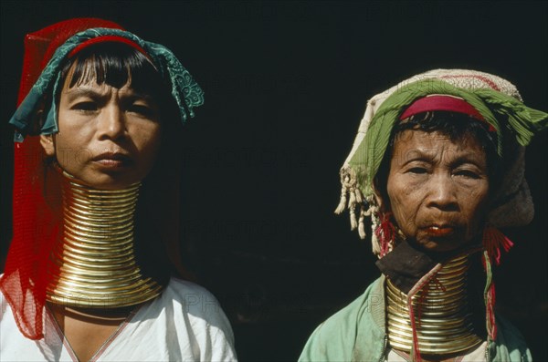 THAILAND, People, Padaung women refugees from Myanmar with their necks encased in traditional rings.