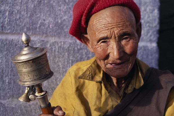 TIBET, Lhasa, Pilgrim at Jokhang temple