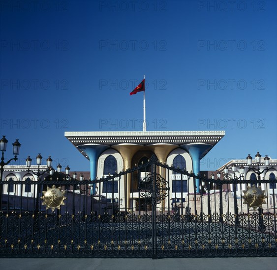 OMAN, Capital Area, Muscat, "Al Alam Palace. Main entranc with blue and gold colomns,ornate gates and flag"