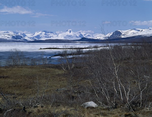 FINLAND, Lapland, " Kilpisjarvi     West view Norway,Way of the Four Winds,lake snow capped peaks "