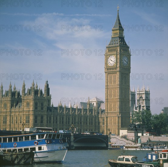 ENGLAND, London, Houses of Parliament Big Ben with the River Thames & boats in the foreground