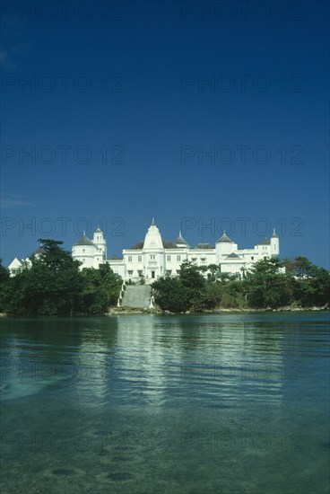 WEST INDIES, Jamaica, Port Antonio, The castle an ornate white building with wide steps leading down to the sea