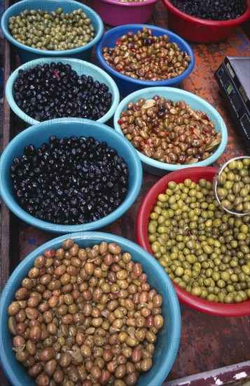 FRANCE, Aquitaine, Issigeac, Varieties of olives in bowls in the weekly Sunday market