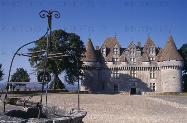FRANCE, Aquitane, Near Bergerac, Chateau Monbazillac with old well in the foreground
