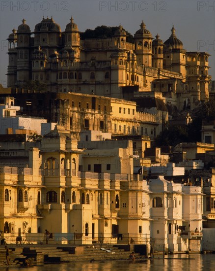 INDIA, Rajasthan, Udaipur, City Palace in evening sunlight
