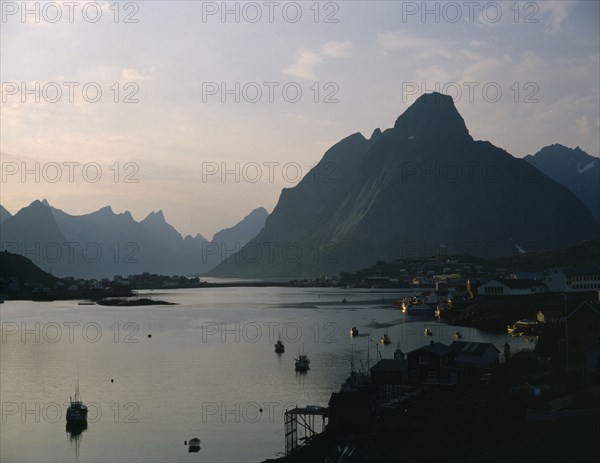 NORWAY, Nordland, Lofoten Islands, "Reine.  Midnight sun, mountains and fjord "