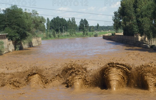 CHINA, Yinchuan, Yellow River, View up the muddy irrigation canal.