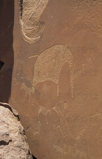 NAMIBIA, Twyfelfontein, Bushman Art possibly dating from 3300BC in the desert depicting an elephant and hyena