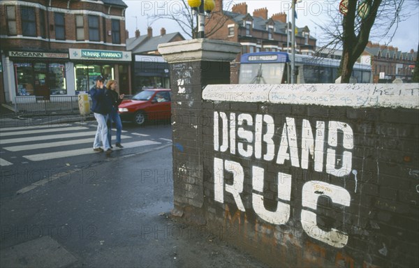 IRELAND, North, Belfast, "Disband RUC grafitti near Falls Road, Donegall Road area"