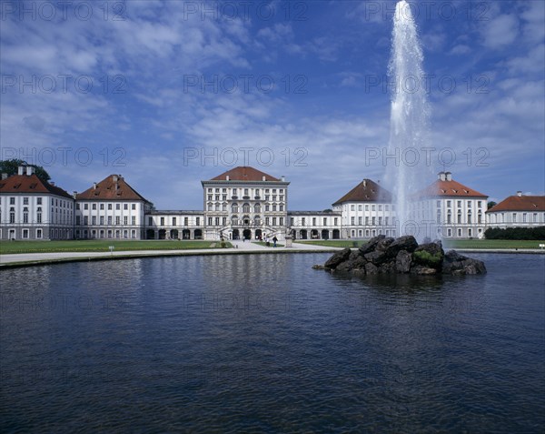 GERMANY, BAVARIA , Munich, Nymphenberg Palace. Ornamental lake with rock fountain and tall water spout