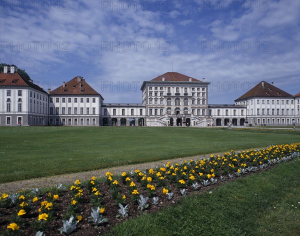 GERMANY, Bavaria, Munich, Nymphenberg Palace. View over lawns and border of yellow marigolds