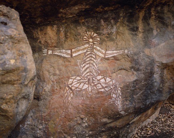 AUSTRALIA, Northern Territory, Kakadu National Park, Aboriginal rock painting onto red and black rock face