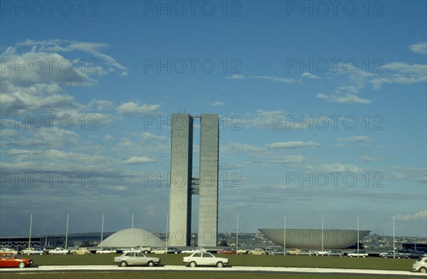 BRAZIL, Federal District, Brasilia, Palace of National Congress buildings seen over road in the foreground