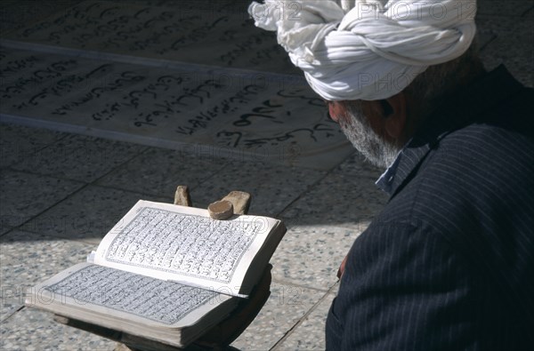 IRAN,   , Yazd, Man reading Koran