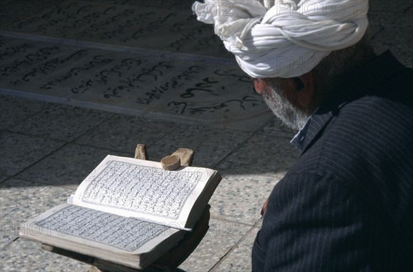 IRAN, , Yazd, Man reading Koran