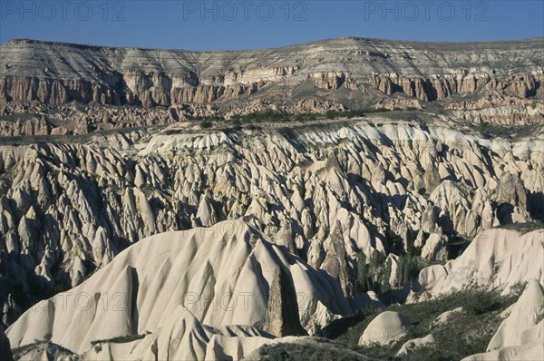 TURKEY, Cappadocia , Rose Valley, Valley with peaks and pinnacles of volcanic rock formations near Goreme.