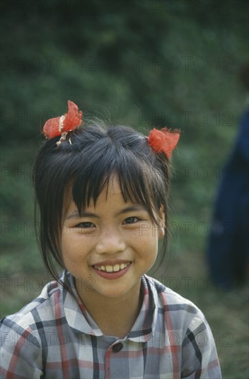 CHINA, General, People, Young girl with ponytails smiling