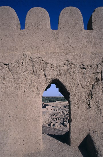 IRAN, Kerman Province, Bam, Arg e Bam Citadel crenellations and view of the old city beyond