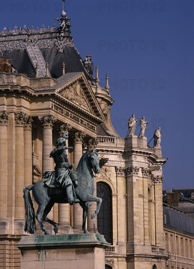 FRANCE, Ile de France, Versailles, Palace detail with bronze statue of man on horse