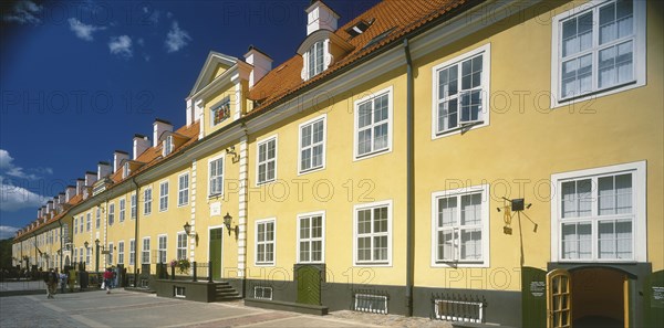 LATVIA, , Riga, Swedish Gate. Row of bright yellow terraced houses