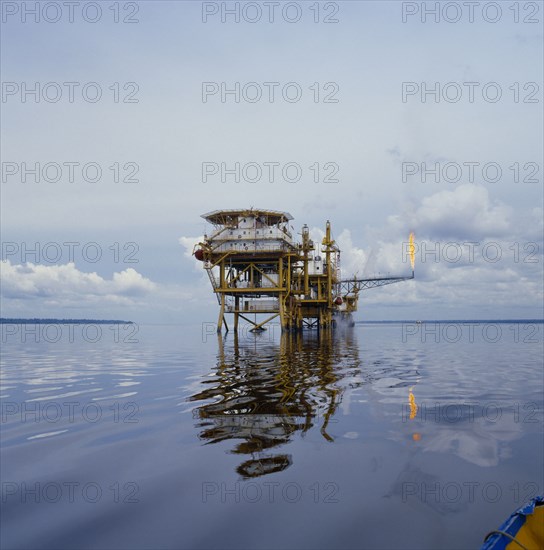 INDUSTRY , Oil , Petroleum, Hudbay oil platform in calm sea with burn off flame