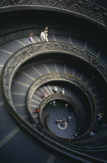 ITALY, Rome  , Vatican City, The spiral staircase in the Vatican Museum with tourists descending the stairs