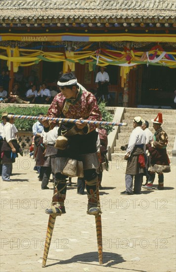 CHINA, Quinghai, Tongren, Dancer on stilts