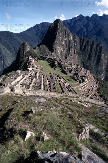 PERU, Cusco, Machu Picchu, General view over the Inca ruins set in rocky mountain landscape