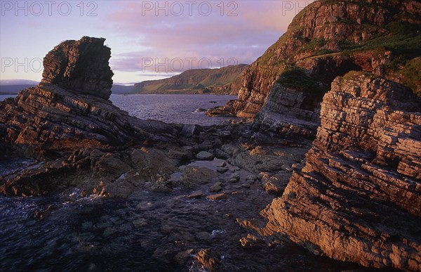 SCOTLAND, Isle Of Mull, Sea stack in evening light