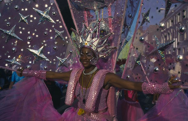 ENGLAND, London, Notting Hill Carnival, Dancer in pink and silver costume.