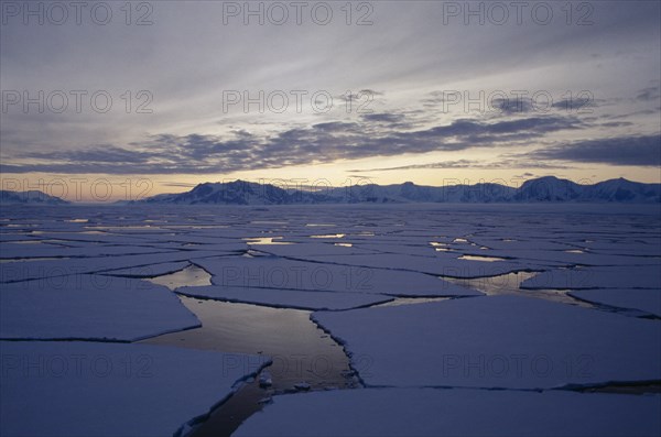 ANTARCTICA , Alexander Island, Broken ice flows at sunset