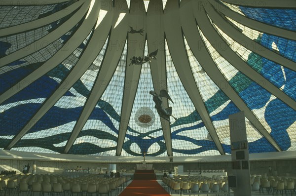 BRAZIL, Federal District, Brasilia, Cathedral interior with patterned glass roof and statues suspended from the ceiling