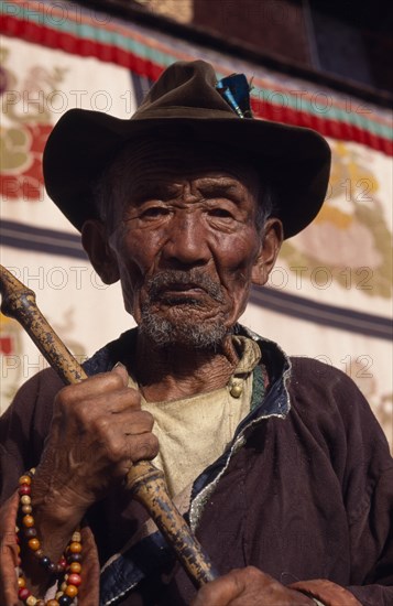 CHINA, Tibet, Lhasa, Portrait of a pilgrim to Jokhang Temple