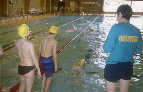 SPORT, Water, Swimming, Children at indoor pool with swim instructor
