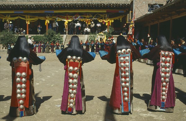 CHINA, Guizhou, Tongren , Tibetan Festival. Girls dancing at Monastery