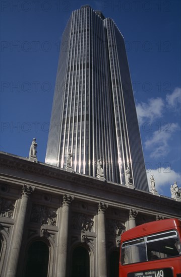 ENGLAND, London, "Tower 42 Previously known as the Nat West Tower, skyscraper towers over neoclassical building in foreground"