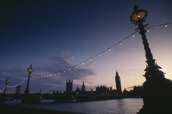 ENGLAND, London, Houses of Parliament seen from across the River Thames at night