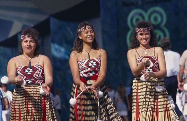 NEW ZEALAND, People, Maori , Maori girls doing Poi dance wearing grass skirts