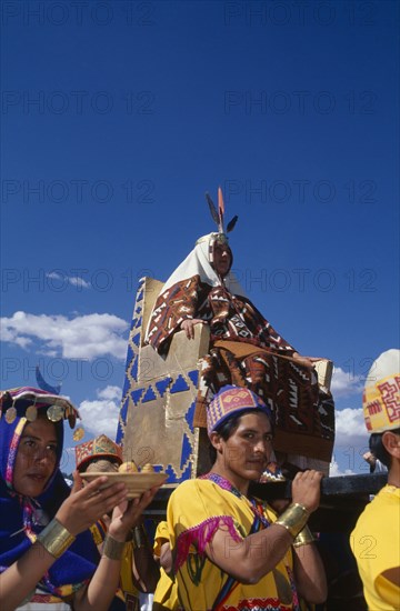 PERU, Cusco Department, Cusco, The wife of the Emperor Pachacuti being carried in her throne at Inti Raymi.