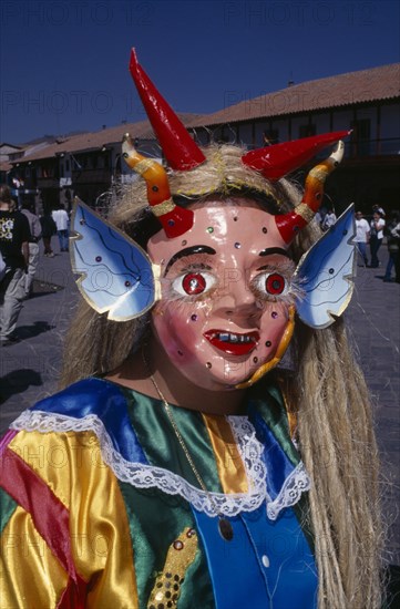 PERU, Cusco, Masked figure at Inti Raymi.  Head and shoulders shot.    Cuzco