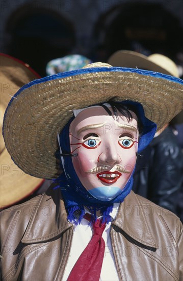 PERU, Cusco, Masked figure at Inti Raymi.  Head and shoulders shot.    Cuzco