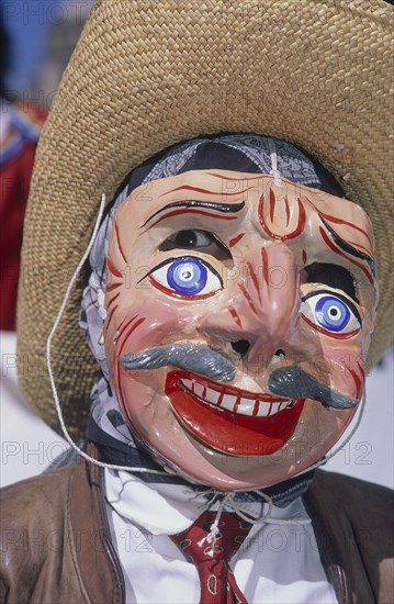 PERU, Cusco Department, Cusco, Masked figure at Inti Raymi.  Close up of masked face.