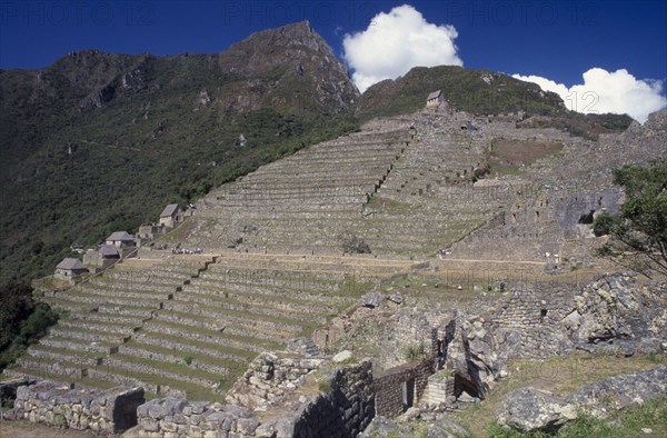 PERU, Cusco Department, Machu Picchu, View across the ruins towards the mountains behind.