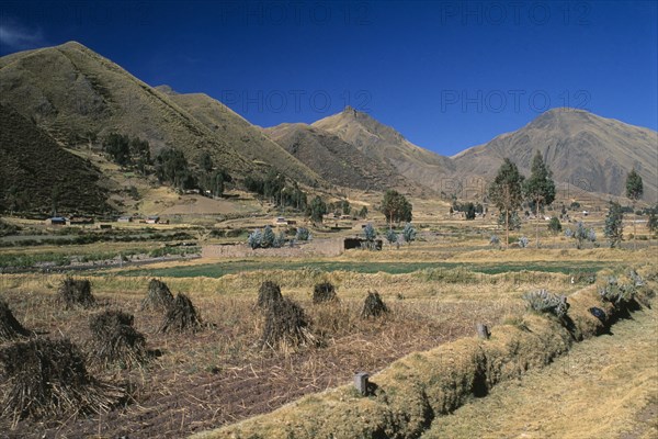 PERU, Puno Administrative Department, La Raya, "View from the train on the altiplano.  Agricultural land in the foreground, mountains beyond.  "