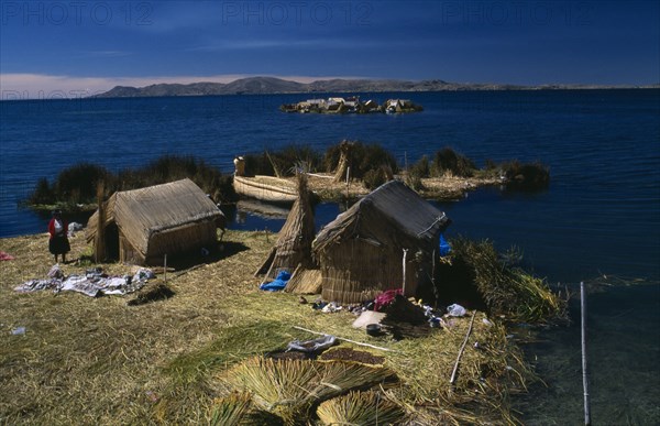 PERU, Puno Administrative Department, Puno, Lake Titicaca.  Reed houses on floating islands built by the Uros people.