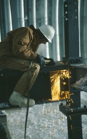 CONSTRUCTION, Welding, "Man wearing protective hat and clothing, welding on a metal structure at the US Amundsen-Scott South Pole Station. "