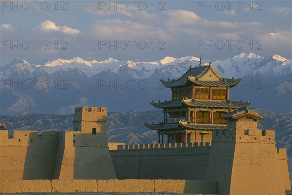 CHINA, Gansu, Jiayuguan, The fortress at the western end of the Great Wall with snow capped mountains behind