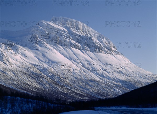 NORWAY, Troms, Lavangsdalen, Snow covered mountainside.