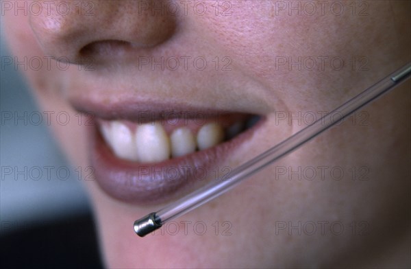 COMMUNICATIONS, Telephone, Telesales, Female telesales operator wearing a telephone head set.  Close up of lower half of face and mouthpiece.