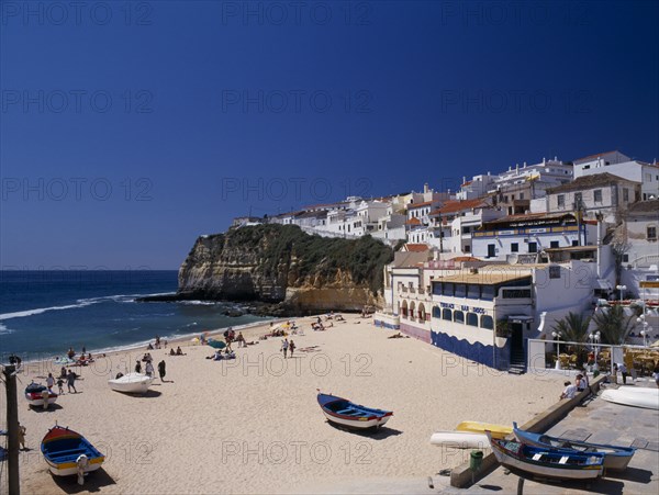 PORTUGAL, Algarve, Carvoeiro, View over the beach in the fishing cove.